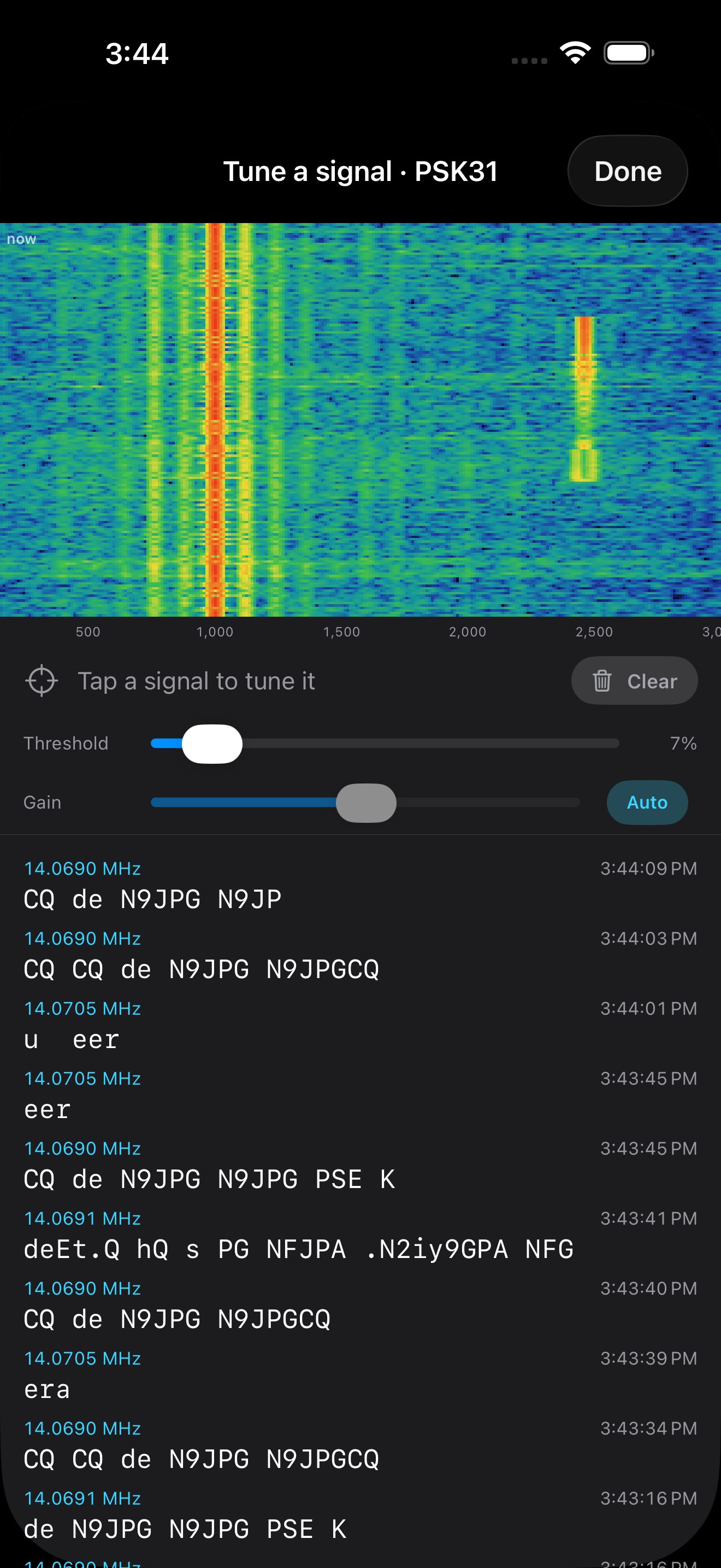 The tune-a-signal picker decoding PSK31 on 20 m — 'CQ de N9JPG N9JPG PSE K' copied live off a tapped signal, with on-screen threshold and gain controls